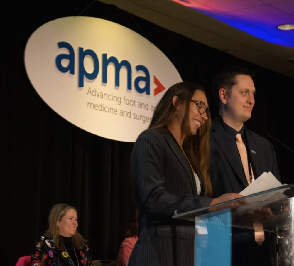 Peter Sorensen at the APMA podium with Dr. Savannah Santiago